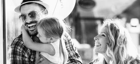 Girl Hugging Smiling Father